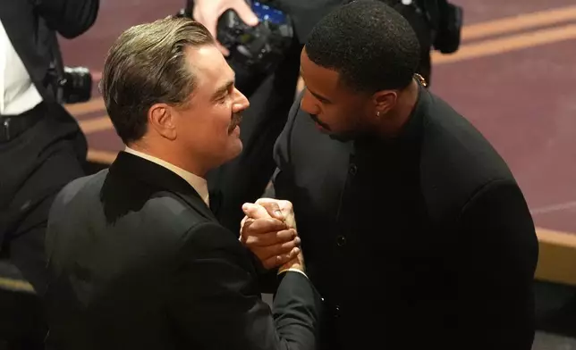 Leonardo DiCaprio, left, and Michael B. Jordan in the audience during the Oscars on Sunday, March 15, 2026, at the Dolby Theatre in Los Angeles. (AP Photo/Chris Pizzello)
