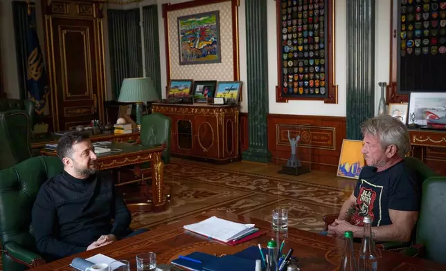 In this photo provided by the Ukrainian Presidential Press Office, Ukrainian President Volodymyr Zelenskyy, left, talks with U.S. actor and director Sean Penn in Kyiv, Ukraine, Monday, March, 2026. (Ukrainian Presidential Press Office via AP)