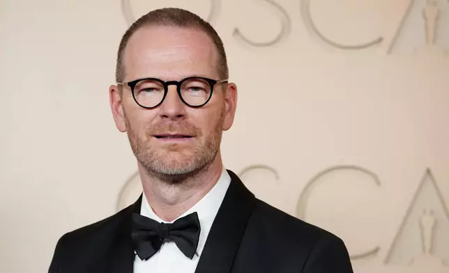 Joachim Trier arrives at the Oscars on Sunday, March 15, 2026, at the Dolby Theatre in Los Angeles. (Photo by Jordan Strauss/Invision/AP)