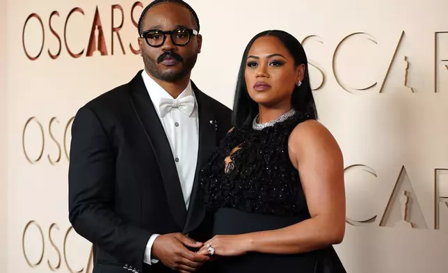 Ryan Coogler, left ,and Zinzi Evans arrive at the Oscars on Sunday, March 15, 2026, at the Dolby Theatre in Los Angeles. (Photo by Jordan Strauss/Invision/AP)