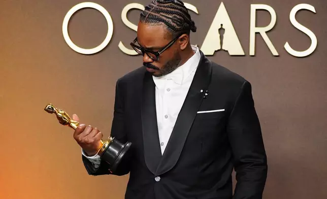Ryan Coogler, winner of the award for writing (original screenplay) for "Sinners," poses in the press room at the Oscars on Sunday, March 15, 2026, at the Dolby Theatre in Los Angeles. (Photo by Jordan Strauss/Invision/AP)