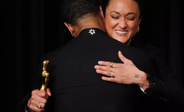 Michael B. Jordan, left, and Autumn Durald Arkapaw, winner of the award for cinematography for "Sinners," pose in the press room at the Oscars on Sunday, March 15, 2026, at the Dolby Theatre in Los Angeles. (Photo by Jordan Strauss/Invision/AP)
