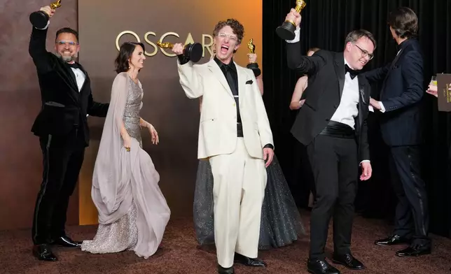 Radovan Sibrt, from left, Alzbeta Karaskova, David Borenstein, and Pavel Talankin, winners of the award for documentary feature film for "Mr. Nobody Against Putin," pose in the press room at the Oscars on Sunday, March 15, 2026, at the Dolby Theatre in Los Angeles. (Photo by Jordan Strauss/Invision/AP)