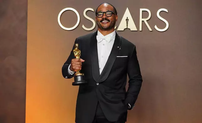 Ryan Coogler, winner of the award for writing (original screenplay) for "Sinners," poses in the press room at the Oscars on Sunday, March 15, 2026, at the Dolby Theatre in Los Angeles. (Photo by Jordan Strauss/Invision/AP)