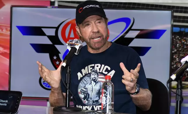 FILE - Chuck Norris speaks to reporters during a media availability before the NASCAR Sprint Cup Series auto race at Texas Motor Speedway in Fort Worth, Texas, on Nov. 6, 2016. (AP Photo/Larry Papke, File)