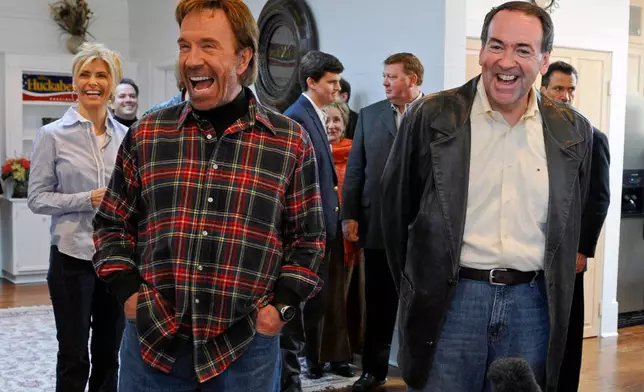 FILE - Republican presidential hopeful, former Arkansas Gov. Mike Huckabee, right, appears with actor Chuck Norris on Jan. 20, 2008 in Navasota, Texas. (AP Photo/Pat Sullivan, File)