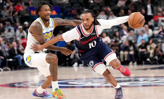 Los Angeles Clippers guard Darius Garland, right, drive past Indiana Pacers guard Quenton Jackson during the second half of an NBA basketball game Wednesday, March 4, 2026, in Inglewood, Calif. (AP Photo/Mark J. Terrill)