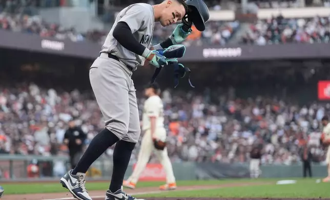 New York Yankees' Aaron Judge reacts after striking out against the San Francisco Giants during the fourth inning of a baseball game in San Francisco, Wednesday, March 25, 2026. (AP Photo/Jeff Chiu)
