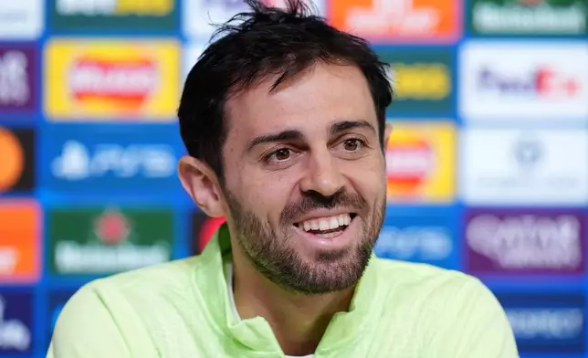 Manchester City's Bernardo Silva speaks during a press conference in Manchester, England, Monday March 16, 2026, one day ahead of their Champions League soccer match against Real Madrid. (Martin Rickett/PA via AP)