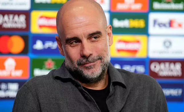Manchester City manager Pep Guardiola looks on during a press conference in Manchester, England, Monday March 16, 2026, one day ahead of their Champions League soccer match against Real Madrid. (Martin Rickett/PA via AP)
