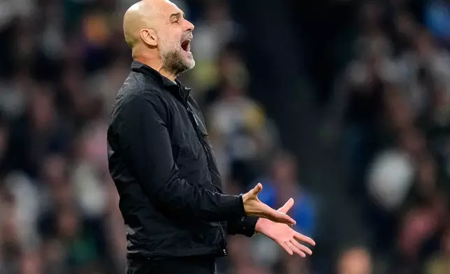 Manchester City's head coach Pep Guardiola reacts during a first leg round of 16 Champions League soccer match between Real Madrid and Manchester City in Madrid, Spain, Wednesday, March 11, 2026. ((AP Photo/Jose Breton)