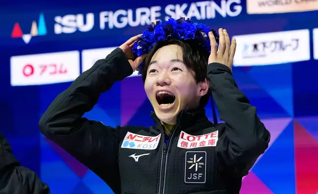 Yuma Kagiyama from Japan reacts after seeing his score during the men free skating at the Figure Skating World Championships in Prague, Czech Republic, Saturday, March 28, 2026. (AP Photo/Petr David Josek)