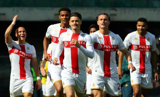 Genoa's Vitinha, front center, celebrates after scoring the opening goal during the Serie A soccer match between Hellas Verona and GFC Genoa 1893 in Verona, Italy, Sunday, March 15, 2026. (Paola Garbuio/LaPresse via AP)