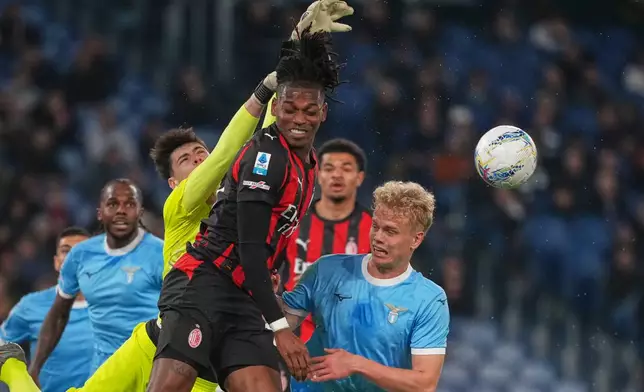 Lazio's goalkeeper Edoardo Motta makes a save against AC Milan's Rafael Leao, centre, during a Serie A soccer match between Lazio and Milan, in Rome, Italy, Sunday, March 15, 2026. (AP Photo/Andrew Medichini)