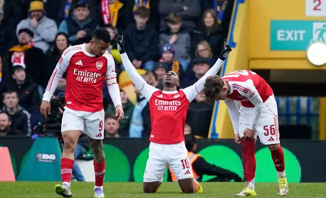 Arsenal's Eberechi Eze celebrates after scoring his side's second goal during the English FA Cup soccer match between Mansfield Town and Arsenal in Mansfield, England, Saturday, March 7, 2026.(AP Photo/Dave Thompson)