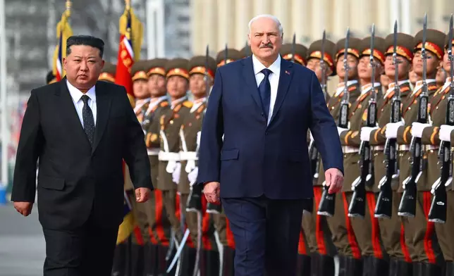 In this photo released by Belarus' Presidential Press Service, North Korea's leader Kim Jong Un, left, and Belarusian President Alexander Lukashenko attend an official meeting ceremony in Pyongyang, North Korea, Wednesday, March 25, 2026. (Belarus' Presidential Press Service via AP)