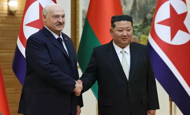 In this photo released by Belarus' Presidential Press Service, North Korea's leader Kim Jong Un, right, and Belarusian President Alexander Lukashenko shake hands during their meeting in Pyongyang, North Korea, Thursday, March 26, 2026. (Belarus' Presidential Press Service via AP)