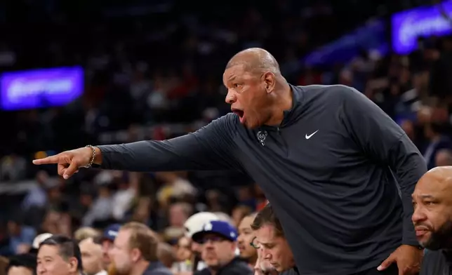 Milwaukee Bucks head coach Doc Rivers yells out to players on the court during the first half of an NBA basketball game against the LA Clippers, Monday, March 23, 2026, in Inglewood, Calif. (AP Photo/Caroline Brehman)