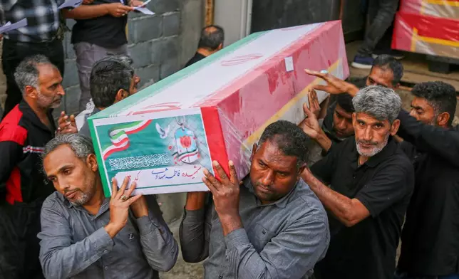 A coffin is carried during the funeral of mostly children killed in a strike Feb. 28 at a girls' elementary school in Minab, Iran, Tuesday, March 3, 2026. (Abbas Zakeri/Mehr News Agency via AP)