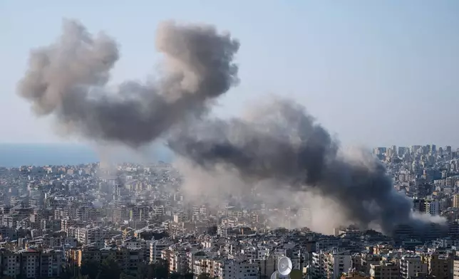 Smoke rise from an Israeli airstrike in Dahiyeh, Beirut's southern suburbs, Lebanon, Tuesday, March 10, 2026. (AP Photo/Bilal Hussein)