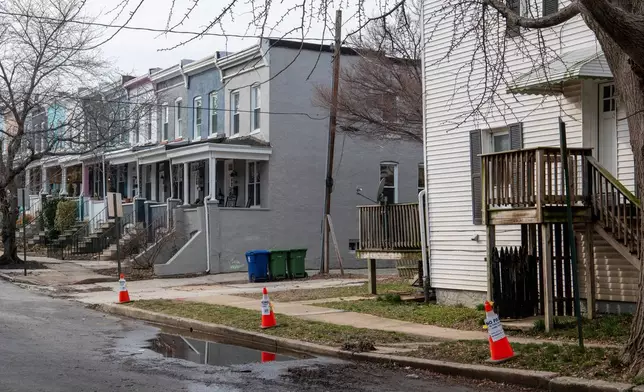 Cones sit near an area of Baltimore that previously suffered a sewage backup on March 5, 2026. (AP Photo/Michael Phillis)