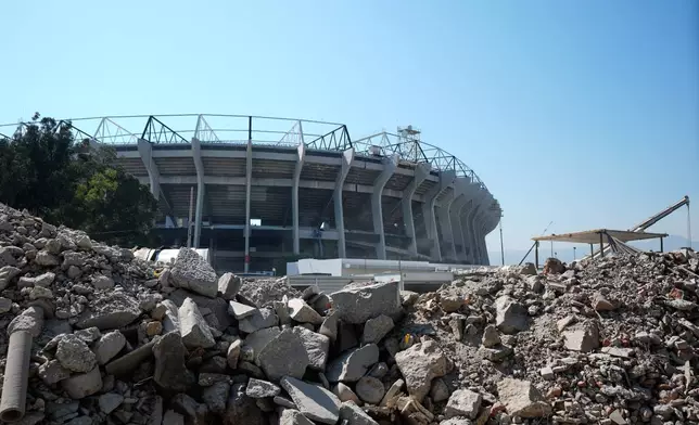 Debris sits in front of the main entrance to the Azteca Stadium, 100 days before the opening ceremony of the 2026 FIFA soccer World Cup, in Mexico City, Tuesday, March 3, 2026. (AP Photo/Fernando Llano)