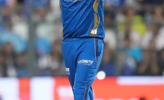 Mumbai Indians' Jasprit Bumrah reacts after bowls a delivery during the Indian Premier League cricket match between Mumbai Indians and Kolkata Knight Riders in Mumbai, India, Sunday, March 29, 2026. (AP Photo/Rafiq Maqbool)