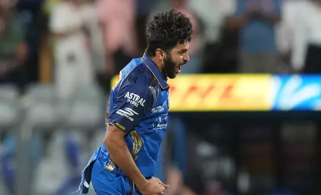 Mumbai Indians’ Shardul Thakur celebrates the wicket of Kolkata Knight Riders’ captain Ajinkya Rahane during the Indian Premier League cricket match between Mumbai Indians and Kolkata Knight Riders in Mumbai, India, Sunday, March 29, 2026. (AP Photo/Rafiq Maqbool)