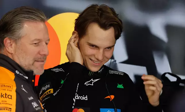 McLaren driver Oscar Piastri of Australia smiles ahead of for the qualifying session of the Japanese Formula One Grand Prix at the Suzuka Circuit in Suzuka, Japan, Saturday, March 28, 2026. (Franck Robichon/Pool Photo via AP)