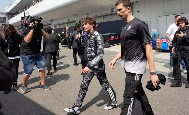 Mercedes driver Kimi Antonelli of Italy walks on the paddock after the third practice session of the Japanese Formula One Grand Prix at the Suzuka Circuit in Suzuka, Japan, Saturday, March 28, 2026. (AP Photo/Eugene Hoshiko)