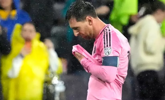 Inter Miami forward Lionel Messi leaves the field in the rain after a draw against Nashville SC in a CONCACAF Champions Cup Round of 16 soccer match, Wednesday, March 11, 2026, in Nashville, Tenn. (AP Photo/Mark Humphrey)