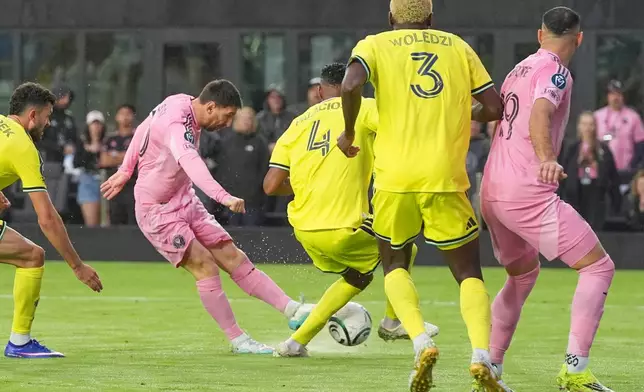 Inter Miami forward Lionel Messi (10) aims to score his 900th goal during a CONCACAF Champions Cup Round of 16 soccer match against Nashville, Wednesday, March 18, 2026, in Fort Lauderdale, Fla. (AP Photo/Marta Lavandier)
