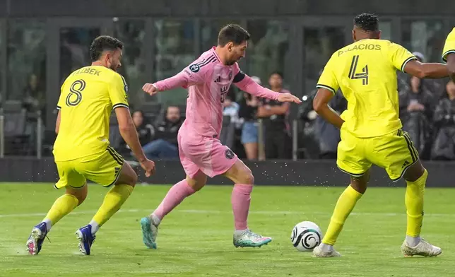 Inter Miami forward Lionel Messi (10) aims to score his 900th goal during a CONCACAF Champions Cup Round of 16 soccer match against Nashville, Wednesday, March 18, 2026, in Fort Lauderdale, Fla. (AP Photo/Marta Lavandier)