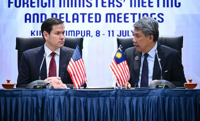 FILE -US Secretary of State Marco Rubio, left, takes part in a memorandum of understanding signing with Malaysia's Minister of Foreign Affairs Mohamad Hasan during the 58th Association of Southeast Asian Nations (ASEAN) Foreign Ministers' meeting and related meetings at the Convention Centre in Kuala Lumpur, July 10, 2025. (Mandel Ngan/Pool Photo via AP, File)