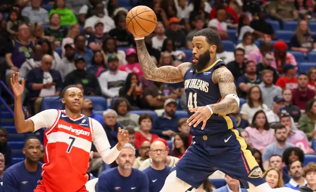 New Orleans Pelicans forward Saddiq Bey (41) intercepts a pass that was intended for Washington Wizards guard Bub Carrington (7) in the second half of an NBA basketball game in New Orleans, Sunday, March 8, 2026. (AP Photo/Peter Forest)