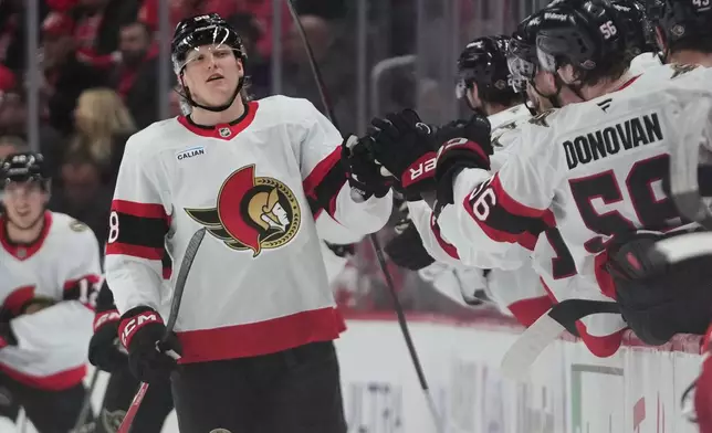 Ottawa Senators' Carter Yakemchuk celebrates his goal against the Detroit Red Wings in the second period of an NHL hockey game Tuesday, March 24, 2026, in Detroit. (AP Photo/Paul Sancya)