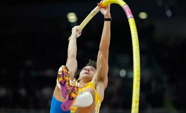 Armand Duplantis, of Sweden, makes an attempt in the men's pole vault final at the World Athletics Indoor Championships in Torun, Poland, Saturday, March 21, 2026. (AP Photo/Matthias Schrader)