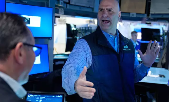 Philip Finale works on the floor at the New York Stock Exchange in New York, Tuesday, March 10, 2026. (AP Photo/Seth Wenig)