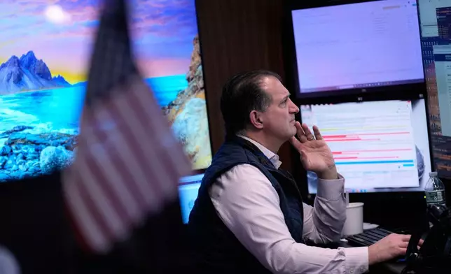 Traders work on the floor at the New York Stock Exchange in New York, Tuesday, March 10, 2026. (AP Photo/Seth Wenig)