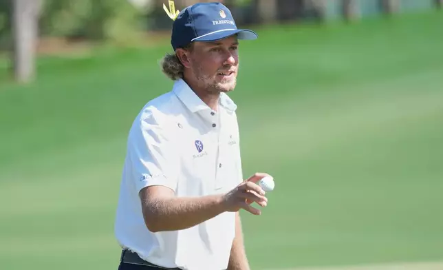 Austin Smotherman shows his balloter a birdie putt on the second hole during the final round of the Cognizant Classic golf tournament, Sunday, March 1, 2026, in Palm Beach Gardens, Fla. (AP Photo/Marta Lavandier)