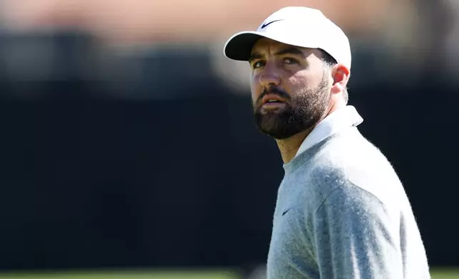 Scottie Scheffler walks on the 18th hole during the third round of the Genesis Invitational golf tournament at Riviera Country Club, Saturday, Feb. 21, 2026, in the Pacific Palisades area of Los Angeles. (AP Photo/Caroline Brehman )