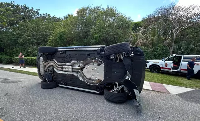 This photo provided by the Martin County Sheriff's Office shows the overturned vehicle in a rollover crash which involved Tiger Woods in Jupiter Island, Fla., on Friday, March 27, 2026. (Martin County Sheriff's Office via AP)