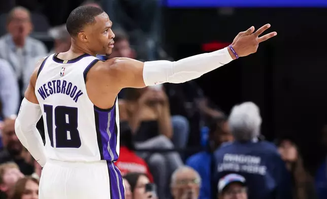 Sacramento Kings guard Russell Westbrook (18) gestures after making a 3 point basket during the second half of an NBA basketball game against the Los Angeles Clippers, Saturday, March 14, 2026, in Inglewood, Calif. (AP Photo/Jessie Alcheh)
