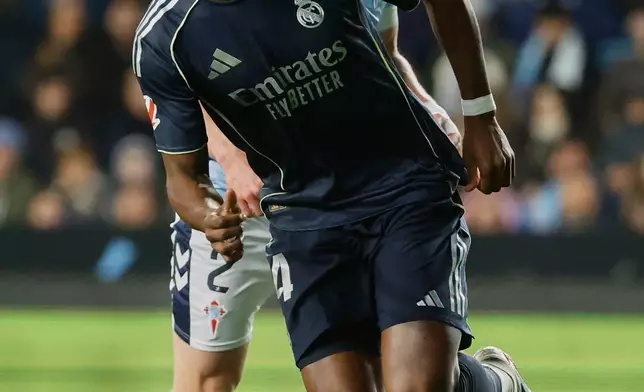 Real Madrid's Aurelien Tchouameni celebrates after scoring the opening goal during a Spanish La Liga soccer match between Celta Vigo and Real Madrid in Vigo, Spain, Friday, March 6, 2026. (AP Photo/Lalo R. Villar)