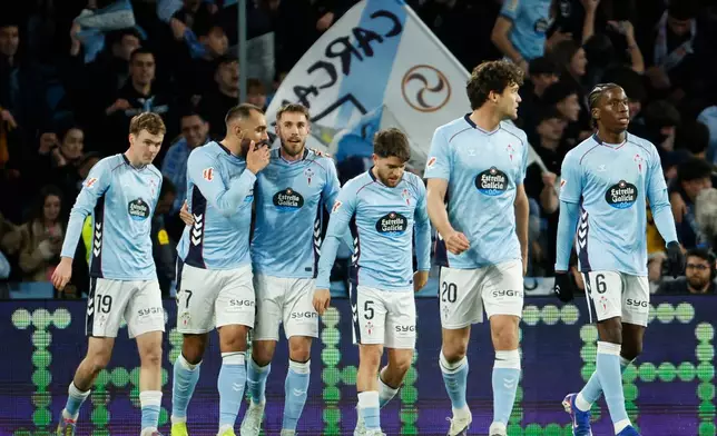 Celta's Borja Iglesias, second left, celebrates after scoring his side's first goal during a Spanish La Liga soccer match between Celta Vigo and Real Madrid in Vigo, Spain, Friday, March 6, 2026. (AP Photo/Lalo R. Villar)