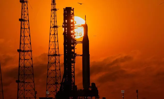 NASA's Space Launch System rocket with the Orion spacecraft set for the Artemis 2 mission is seen on Launch Complex 39B at sunrise at the Kennedy Space Center, Tuesday, March 24, 2026, in Cape Canaveral, Fla. (AP Photo/John Raoux)