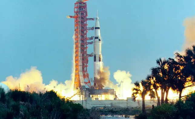 FILE - In this April 11, 1970, photo made available by NASA, the Saturn V rocket carrying the crew of the Apollo 13 mission to the moon launches from the Kennedy Space Center in Florida. (NASA via AP)