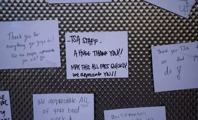 Messages written for TSA agents are displayed on a board at Los Angeles International Airport in Los Angeles, Friday, March 27, 2026. (AP Photo/Jae C. Hong)