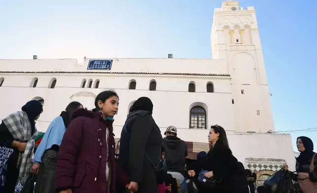 People stock up on food at a market in Algiers, Algeria, Thursday, Feb. 17, 2026, before the start of the holy month of Ramadan. (AP Photo/Fateh Guidoum)