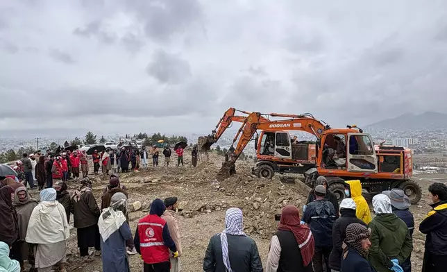 Bulldozers dig graves for victims of a Monday airstrike on a drug rehabilitation hospital in Kabul, Afghanistan, Wednesday, March 18, 2026. (AP Photo/Siddiqullah Alizai)